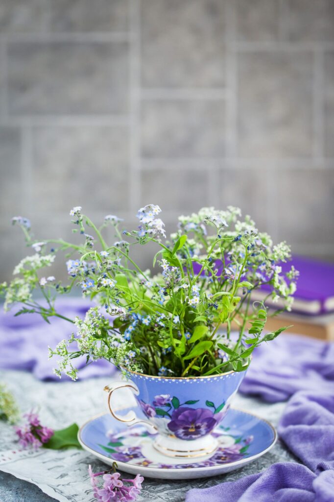 Bouquet of forget-me-nots in ceramic cup