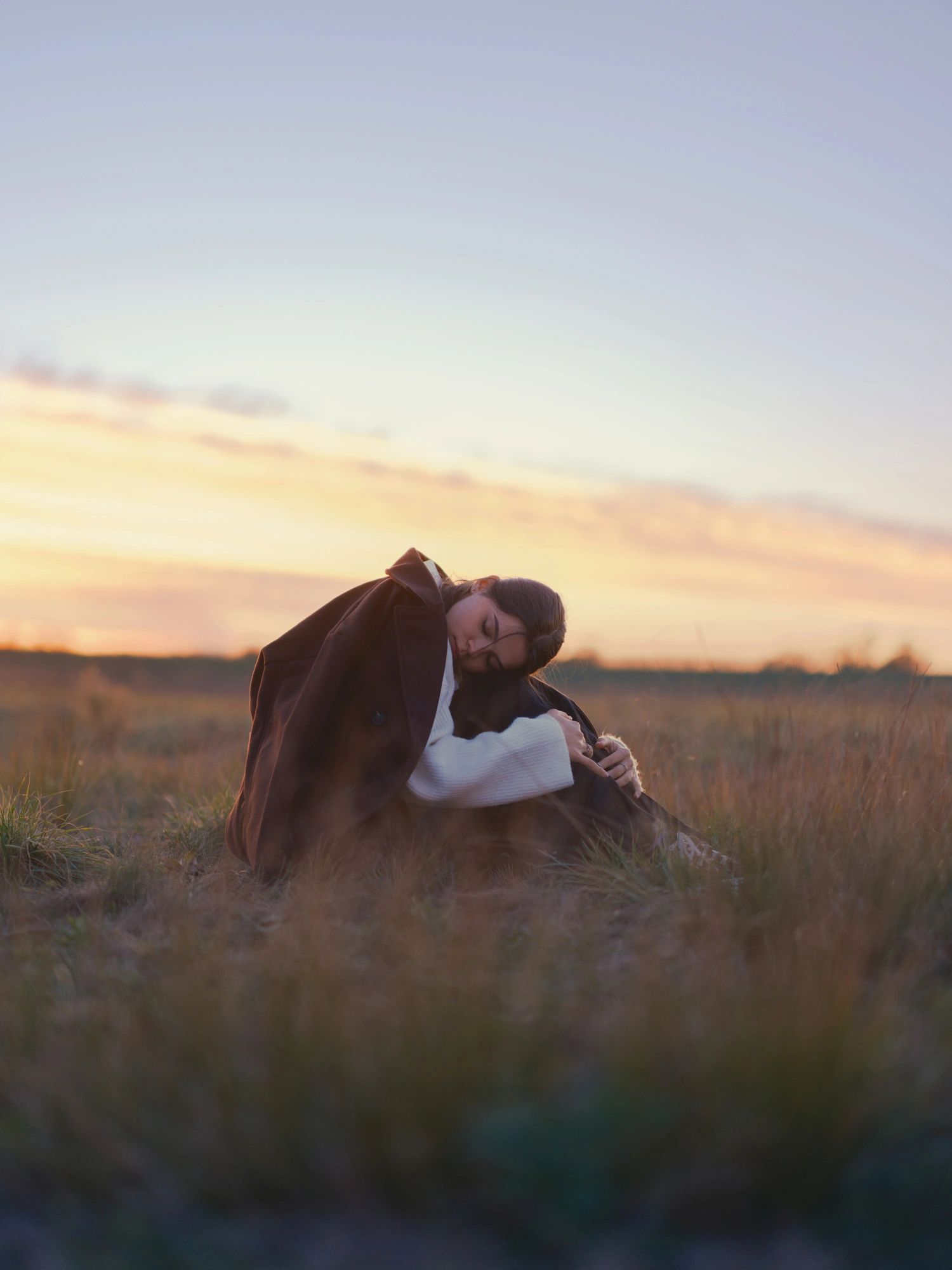 Peaceful portrait in a field at sunset